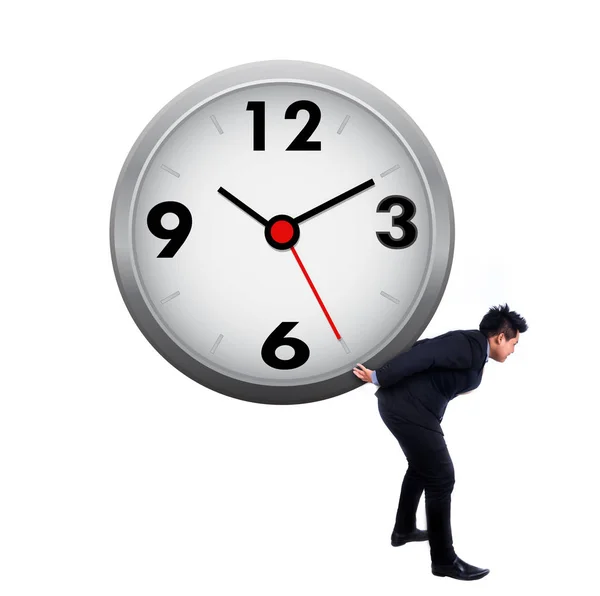 Asian businessman carrying a clock on white — Stock Photo, Image