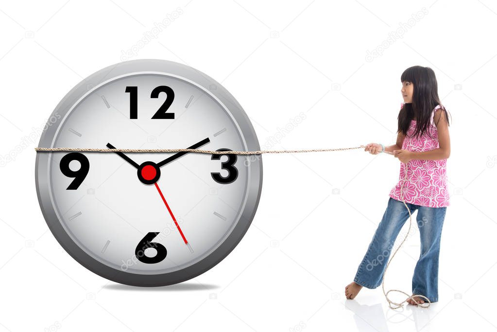 Conceptual Asian girl pulling clock on white.