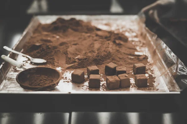Cocoa powder on chocolate tray. — Stock Photo, Image