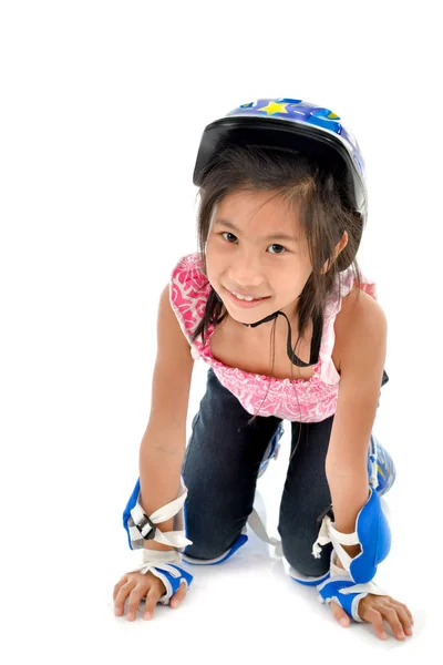 Happy girl 8 years old with roller and gear resting on white bac — Stock Photo, Image