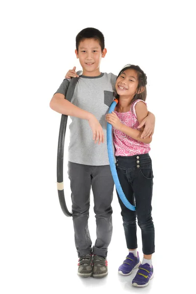 Portrait of happy little Asian children playing hulahoop on isol — Stock Photo, Image