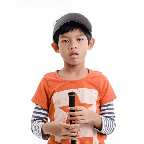 Porträtt av en pojke som håller en golfklubb. — Stockfoto