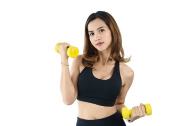 Beyaz, yaşam tarzı konsepti üzerinde dambıl kullanan Asyalı kadın..