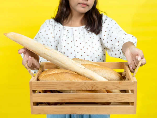 Happy Asian Teenager Girl Holding Bread Baguette Yellow Background Copy Royalty Free Stock Images