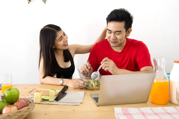 Happy Asian Couple Using Laptop Eating Salad Fresh Fruit Home — Foto de Stock