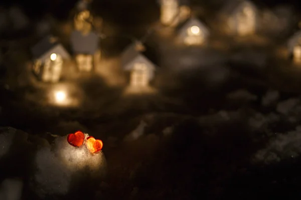 Two Red Glass Hearts Snow Front Garland Wooden Houses Light — 스톡 사진