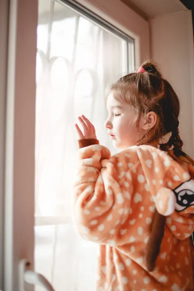 Little Girl Plush Pajamas Hood Plays Window Curtain Girl Walks — Stock Photo, Image
