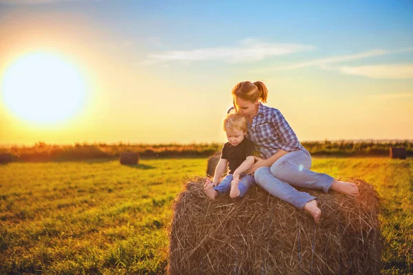 Mom Son Sunset Sit Field Haystack Hug Setting Sun Rural — Stock Photo, Image