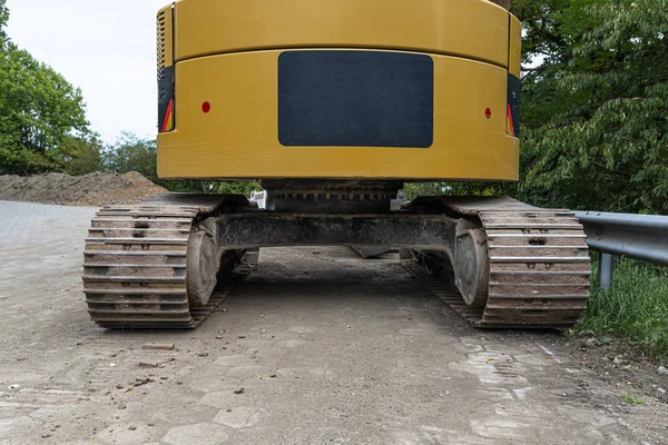 Large Yellow Excavator Visible Rear Standing Concrete — Stock Photo, Image