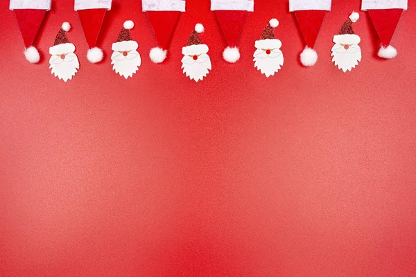 Santa Claus Hats Santa Claus Faces Made Material Arranged Row — Stock Photo, Image