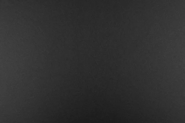 Czarne Tło Wykonane Prawdziwego Czarnego Papieru Matowej Strukturze Włóknistej Oświetlone — Zdjęcie stockowe