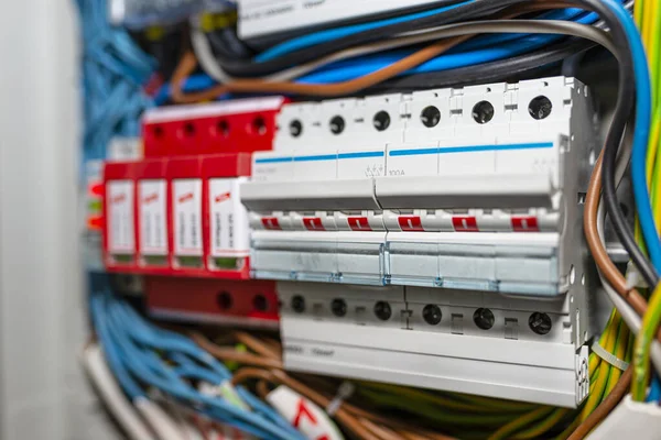 Three-phase fuse in the ON position and surge arrester used to protect the electrical system in the building during electrical discharges, storm protection.