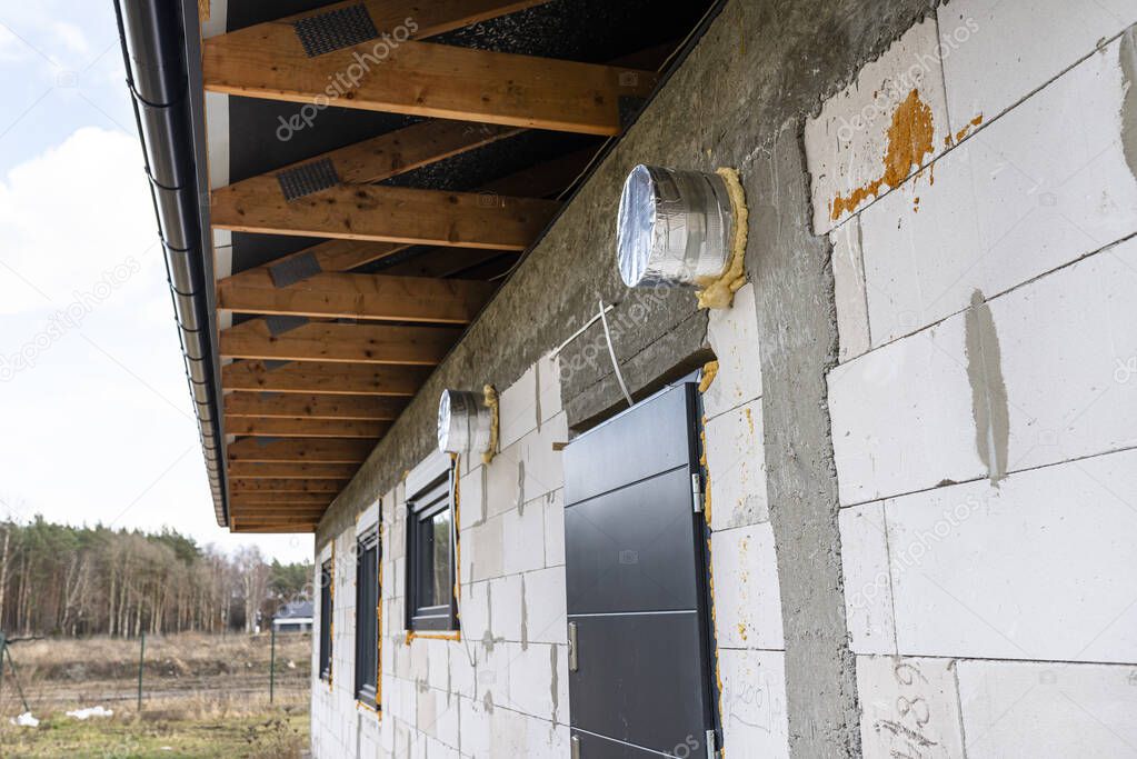 Air intake and air outlet in the wall of a single-family house to the home energy recovery ventilation.