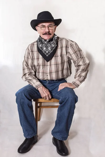 The cowboy with mustache, in a black hat — Stock Photo, Image