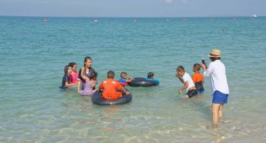  Sai Kaew Beach Sattahip-Military Beach. Children play in the wa clipart