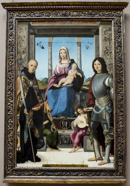 Francesco Marmitta. The Madonna and Child betwixt Saint Benoit a — Stock Photo, Image