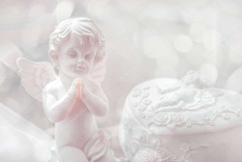 Close-up of baby angel statuette