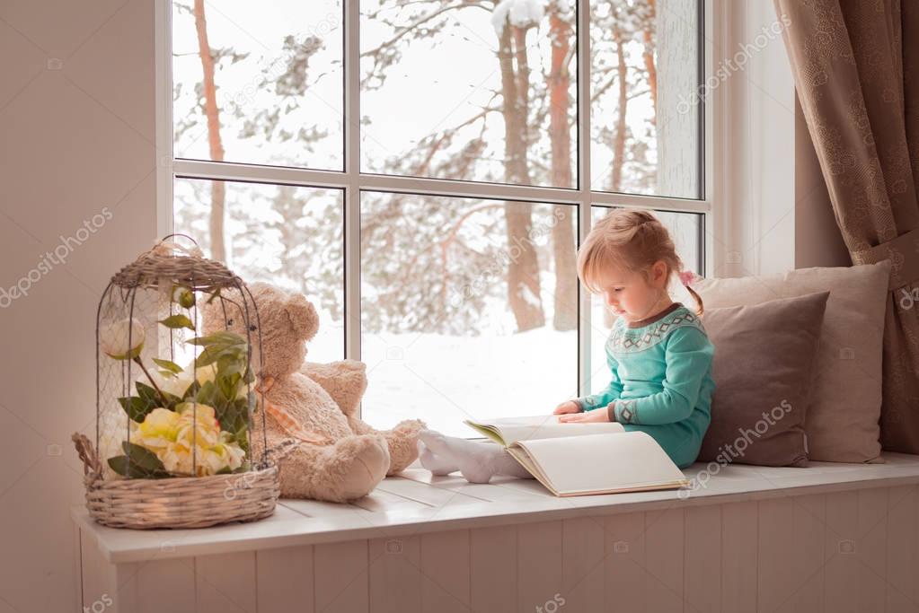 3 years old girl reading