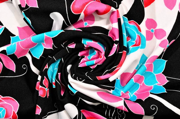 Floral pattern with pink and blue on black and white folded fabric — Stock Photo, Image