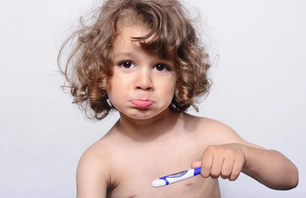 Toddler sick, trying to get his temperature with the termometer. Sad ill boy, having a flu. Beautiful boy got a cold and he gets a treatment. — Stock Photo, Image