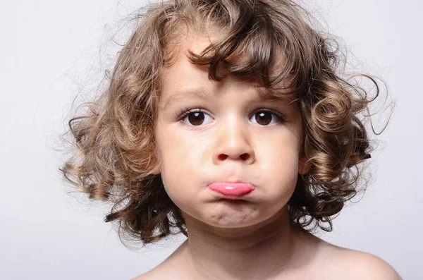 Portrait of a beautiful sad boy. Toddler feeling sadness because he was disappointed. Adorable boy having different emotions — Stock Photo, Image