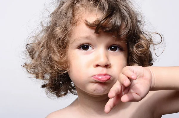 Portrait of a beautiful sad boy. Toddler feeling sadness because he was disappointed. Adorable boy having different emotions — Stock Photo, Image