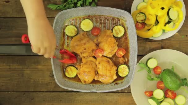 Chicken with vegetables is fried in a grill pan — Stock Video