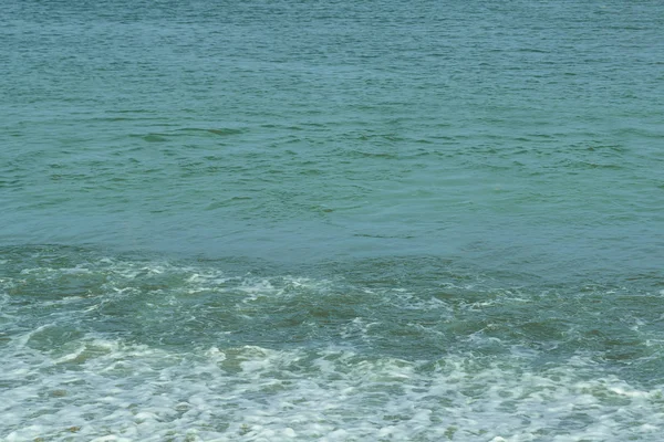 Greenish water in the sea off the coast. — Stock Photo, Image
