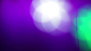 Stage light with filters in the shape of moving flowers.
