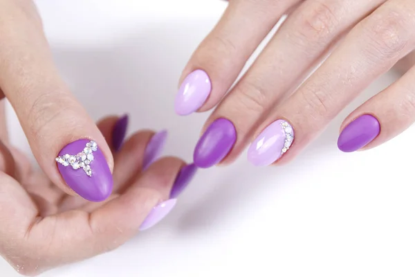 Hands of a client with manicure gel polish of two colors and rhinestones. — Stock Photo, Image