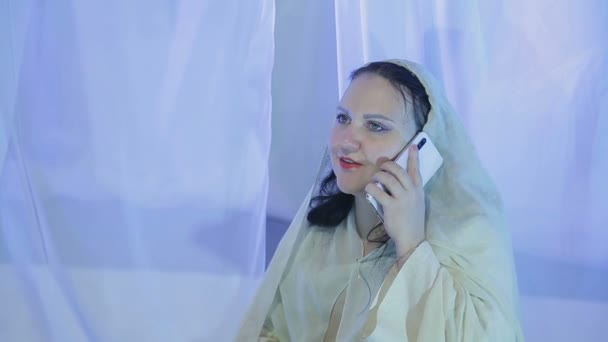 Woman bride in white before the wedding accepts greetings by mobile phone — 비디오