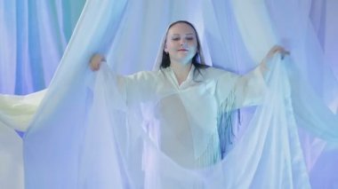 A young Jewish bride is dancing near the chuppah before the wedding