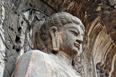 The main Buddha Statue around Longmen Grottoes on the hill. Pic  clipart