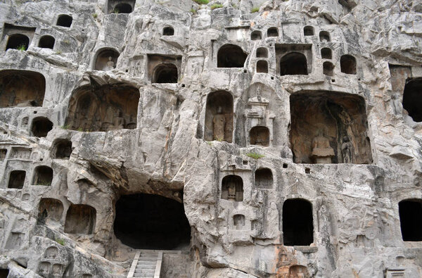 The holes (with Buddha statue inside) -which is more than thousa