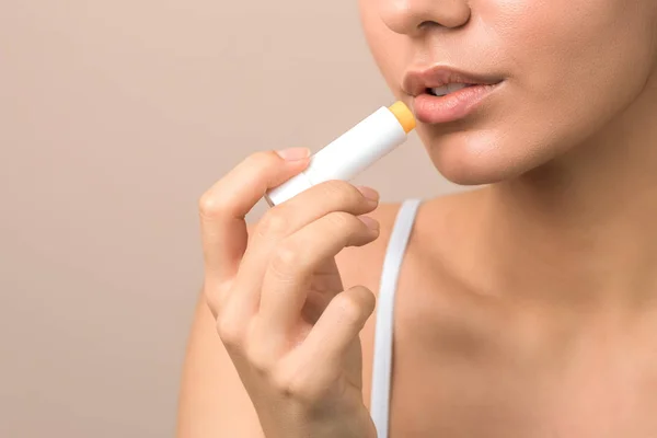 Lips care and protection. woman applying balm on lips — ストック写真