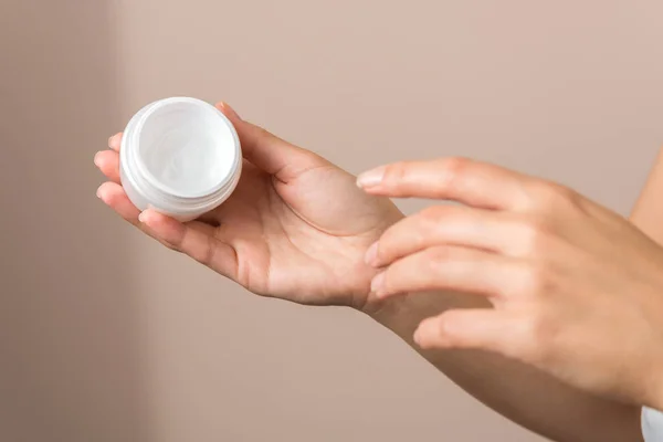 Close up view of woman hand moisturising them with cream. skincare — 스톡 사진