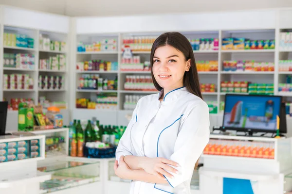 Smart and confident woman pharmacist smiling. the face of the drug store — Stock Photo, Image