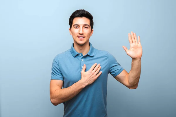 Handsome Young Man Neutral Smile Blue Polo Shirt Hand Chest — Stock Photo, Image
