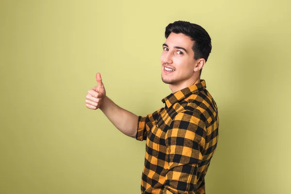 Handsome Brunette Young Man Showing Big Thumb Yellow Background — Stock Photo, Image