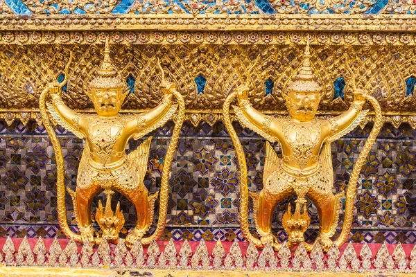 Golden garuda decoration on wall of main Buddhist church or 