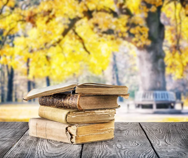 Stack of old books on wooden table — Stock Photo, Image