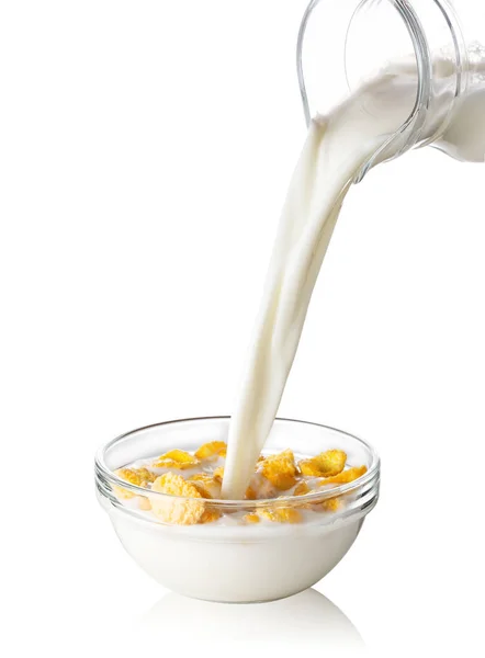 Corn flakes s tekoucí mléko — Stock fotografie