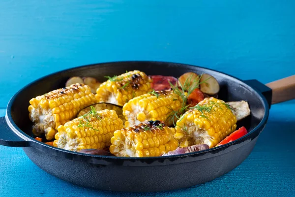 Corn and vegetables baked in frying pan — Stock Photo, Image