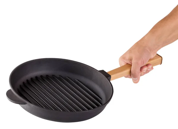 Hand with a black frying pan — Stock Photo, Image
