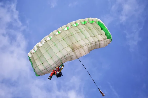 Extreme active paraglider flyng over