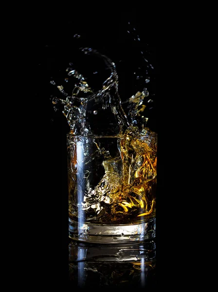 Splash in glass of whiskey — Stock Photo, Image