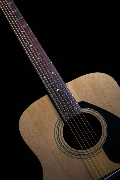 Guitar acoustic on black background — Stock Photo, Image