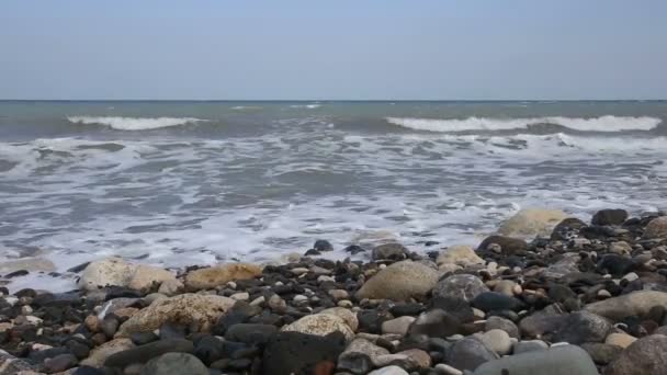 Sea waves rolling on pebble beach — Stock Video