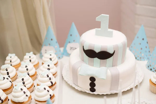 Birthday cake on a table. First birthday party