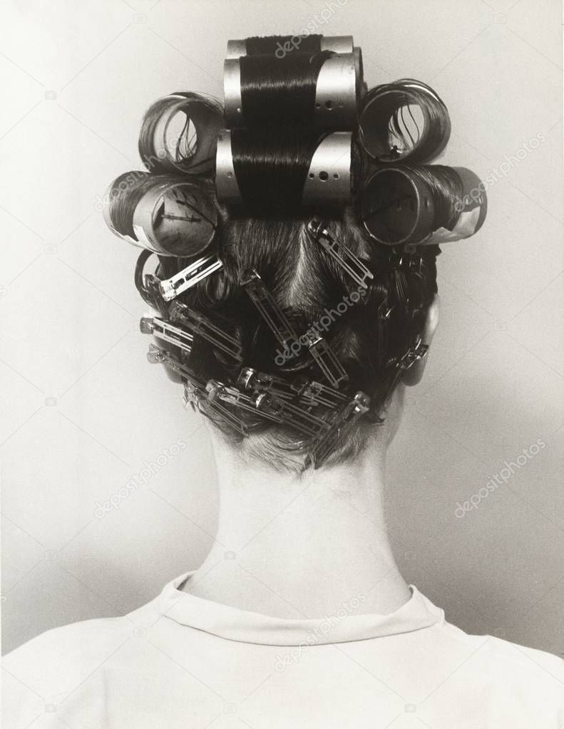  woman with curlers in hair
